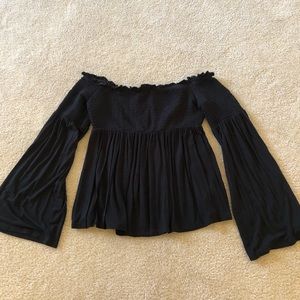 black flowy off the shoulder blouse